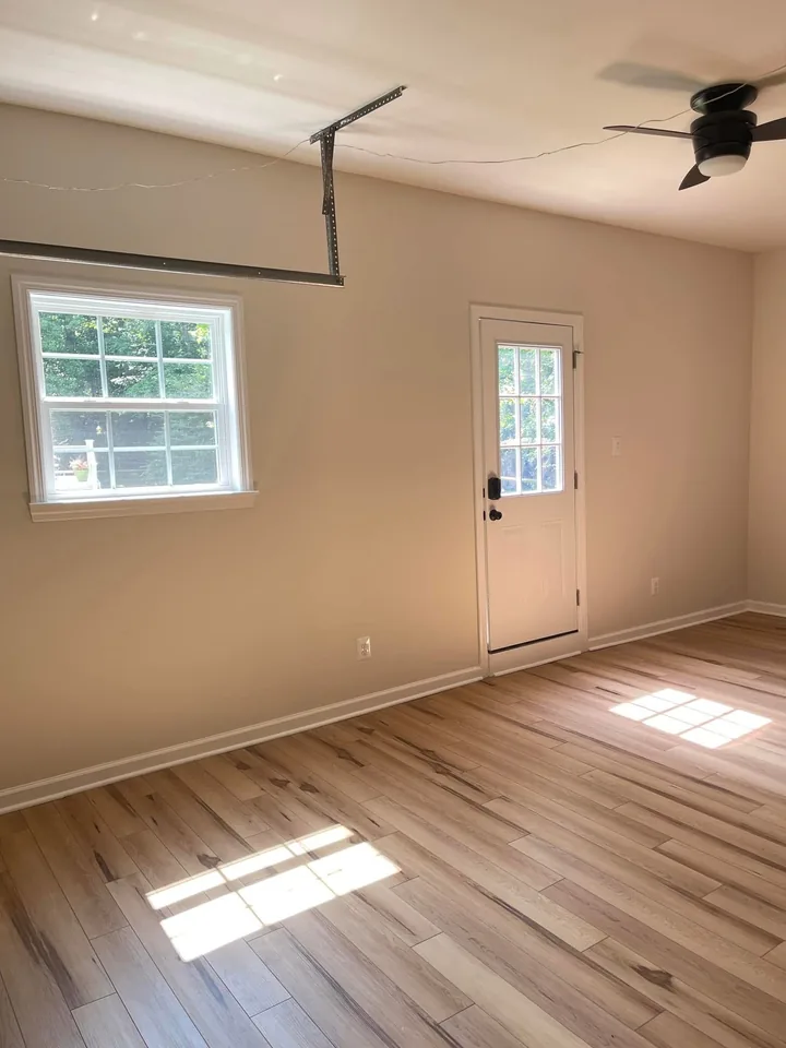 The corner of the finished room with the new window and the new door installed.