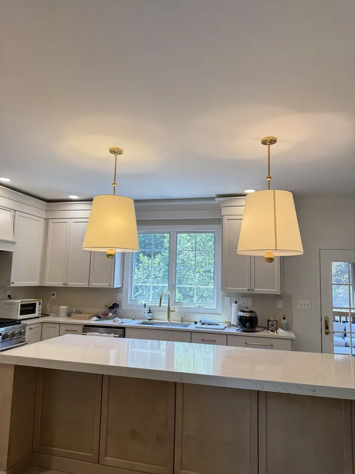 The same kitchen ceiling after the drywall was repaired, finished, and painted.